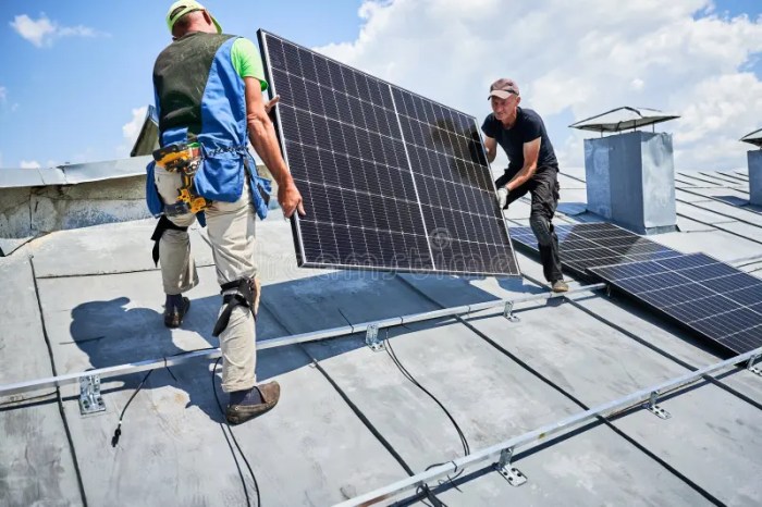Workers Building Solar Panel System on Roof of House. Men Installing ...